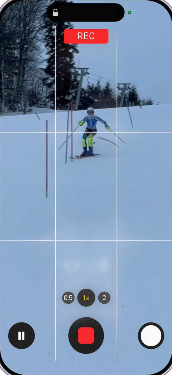 A phone filming a slalom run from beside the course.